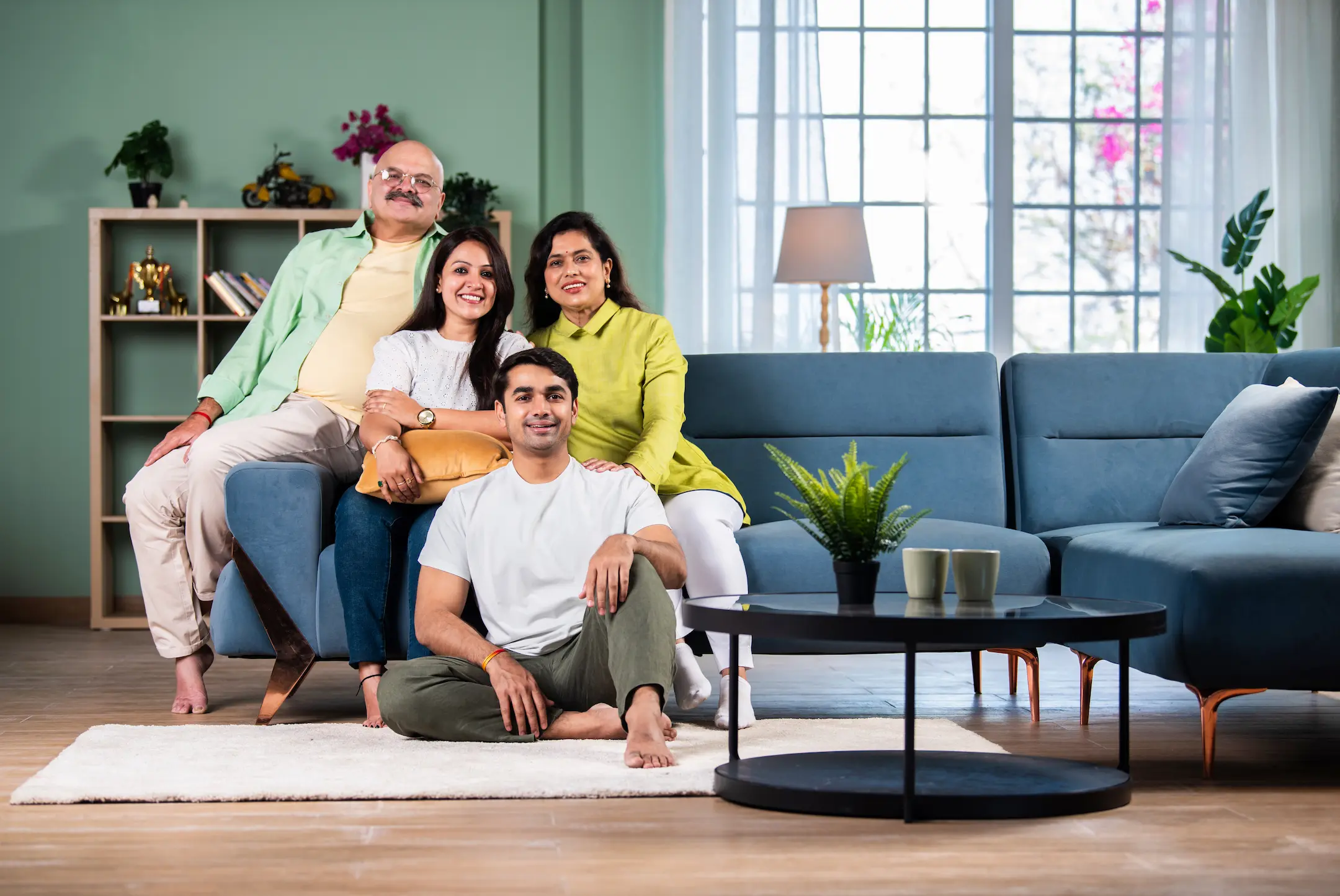 portrait of happy indian family interior